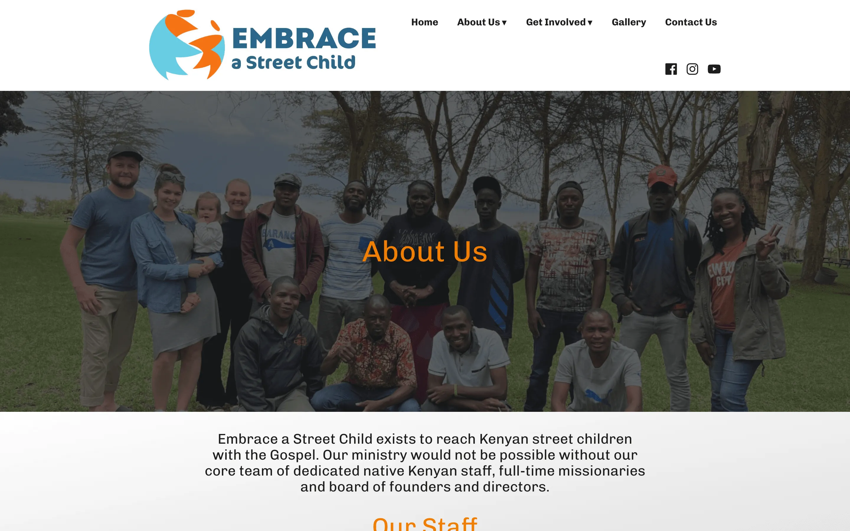 The old About Us page: the word “About Us” over a staff group photograph, above a three-sentence summary